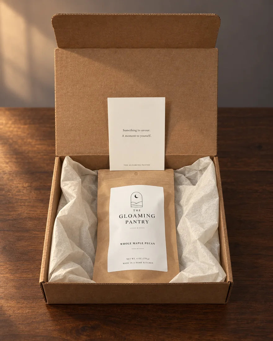 Whole Maple Pecan pouch and brand card in an open kraft box